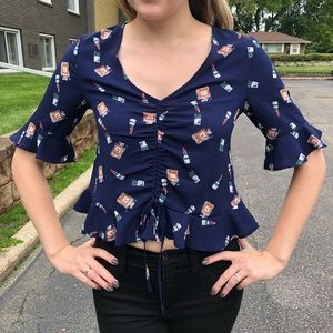 Elodie perfume and lipstick pattered crop top